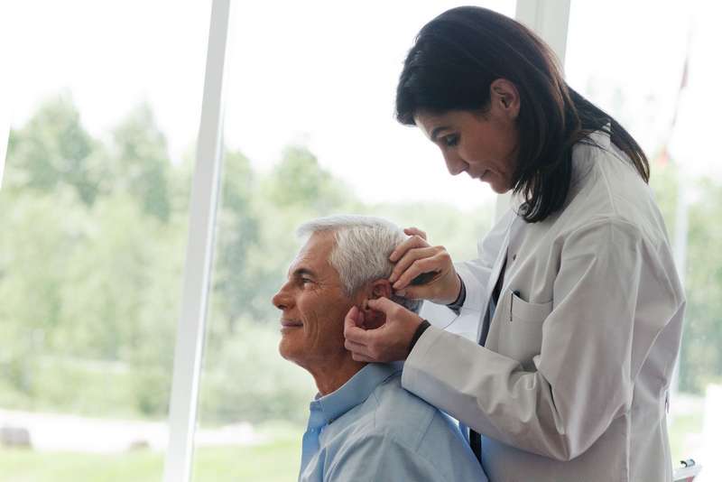 adjusting hearing aid