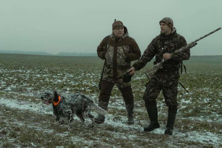 two hunters and the dog