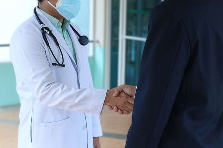 doctor and patient handshake