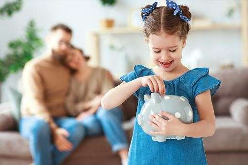 child with piggybank