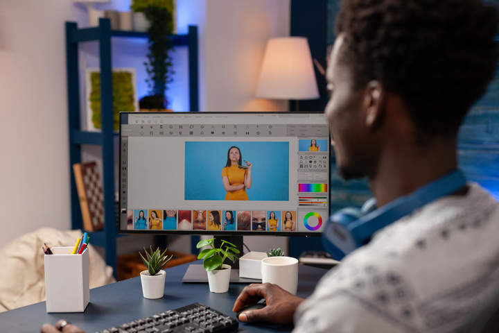 African american photographer editing digital photography using post production editing software. Young illustrator editor working remote at photos retouch. Creativity studio at home